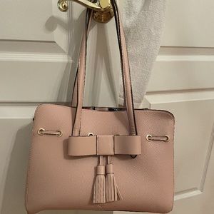 Brand new handbag ticket still on